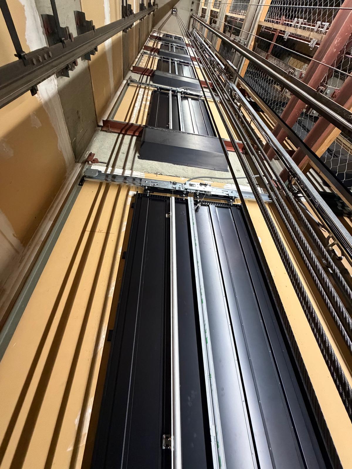 View up the lift shaft showing landing door equipment